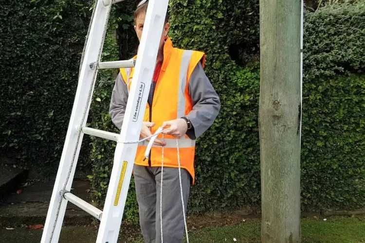 Is it illegal to put the ladder against the pole