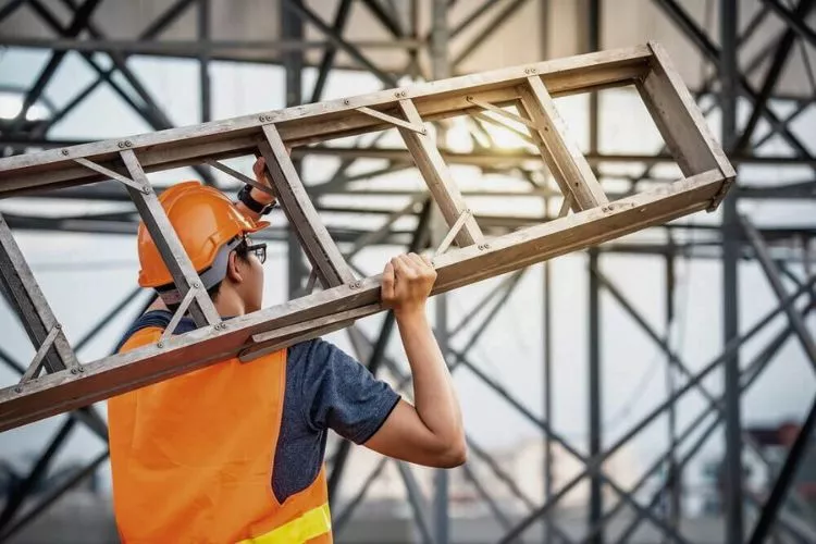 What is required if a defective ladder is found on the construction site